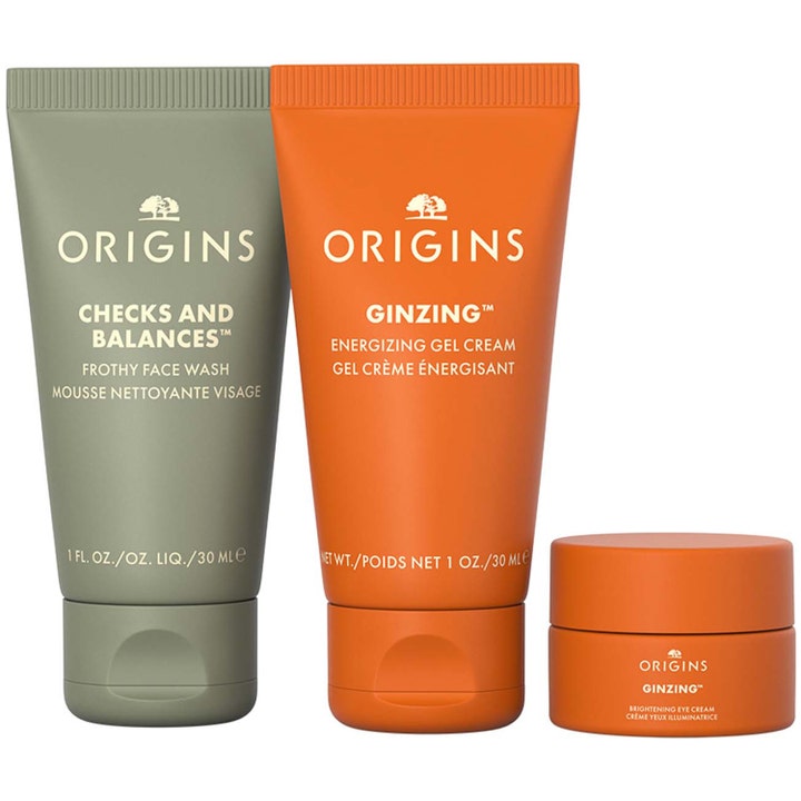 Origins Mini Travel Essentials energigivande hudvårdskit med ansiktstvätt och kräm i gröna och orangea tuber.