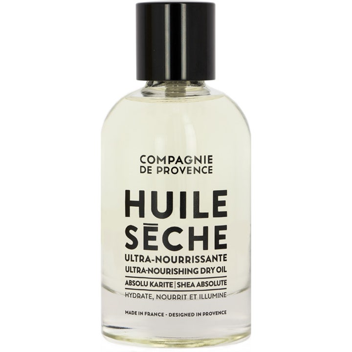 Compagnie de Provence Huile Sèche Shea Absolute återfuktande torrolja i genomskinlig glasflaska med svart lock