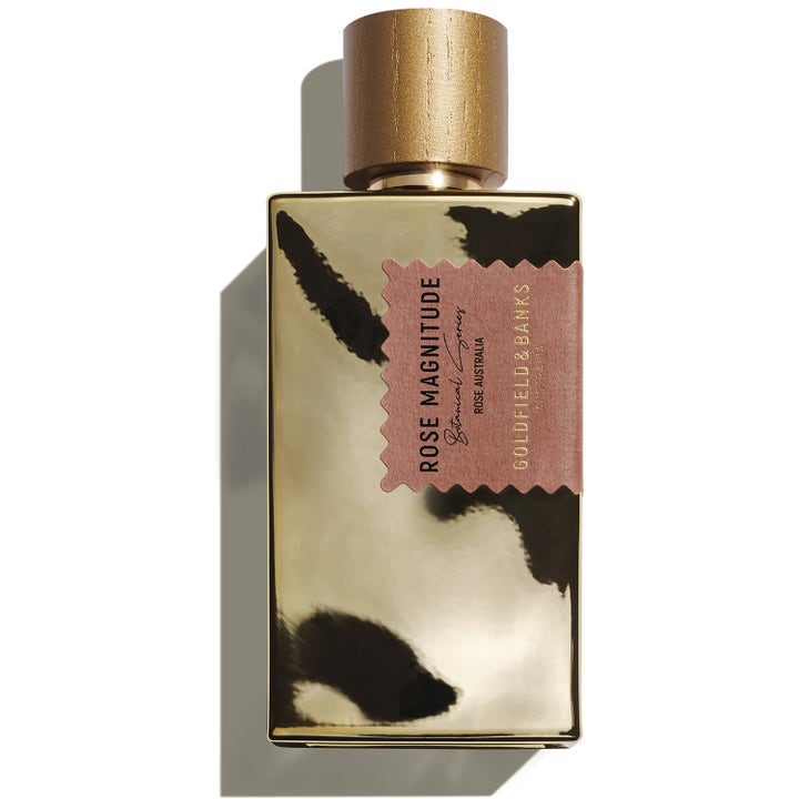Goldfield & Banks Rose Magnitude 100 ml eau de parfum i guldglänsande flaska med rosa etikett och träliknande guldlock