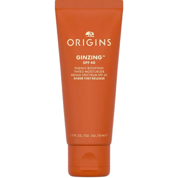 Origins GinZing SPF 40 50 ml solkräm ansikte med färg i en klarorange tub som ger huden lyster.