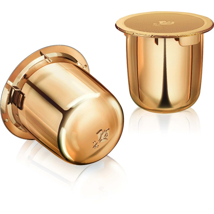 Lancôme Absolue Refill 60ml lystergivande ansiktskräm visas som två lyxiga guldglänsande kapslar i metallisk finish.