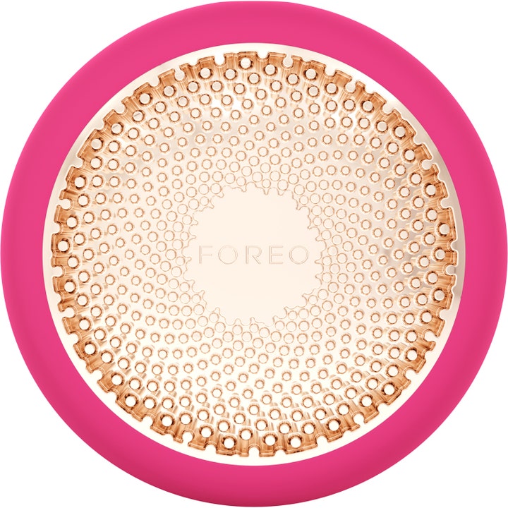 FOREO UFO ansiktsbehandling hemma LED ger lyxig återfuktande hudvårdsteknologi i rosa silikon med mönstrad guldplatta.