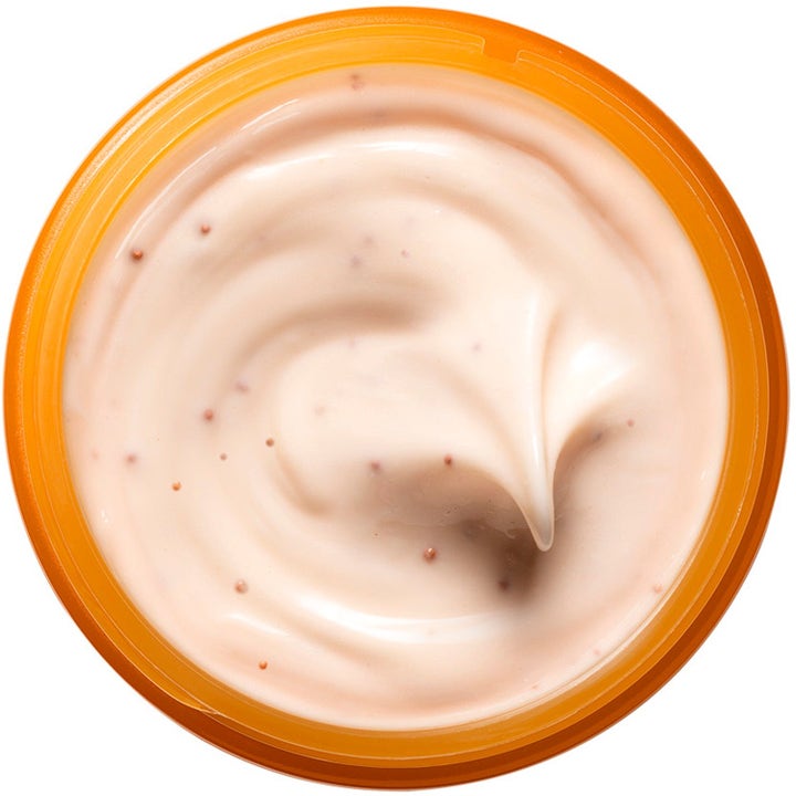 Origins Ljusare Hy Glow-Boosting Rutin 125 ml ansiktsmask ger lyster med krämig persikofärgad textur och korn.