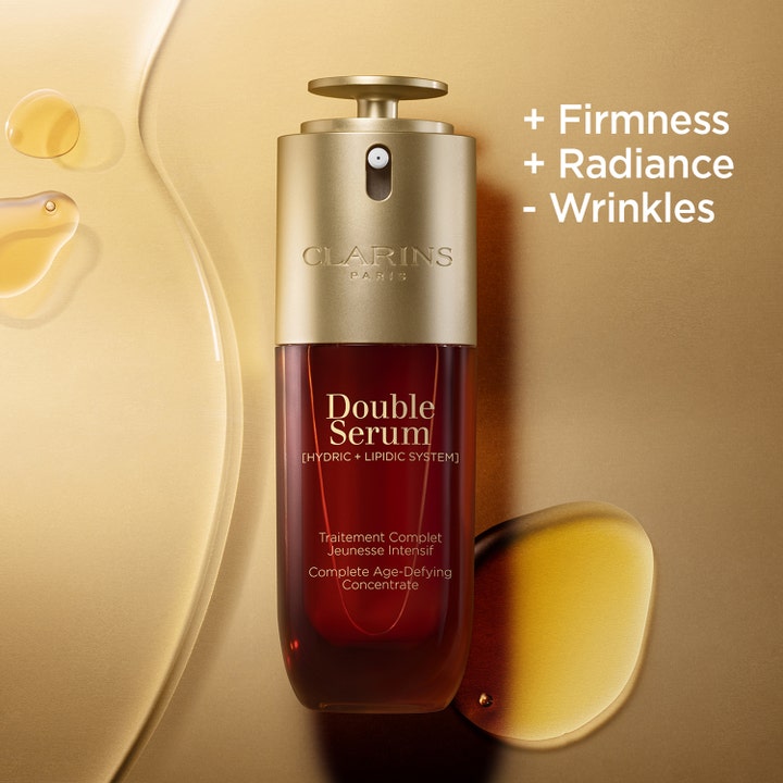 Clarins Double Serum 30 ml hudvårdande dubbelserum i bärnstensfärgad flaska med texten + Firmness + Radiance.